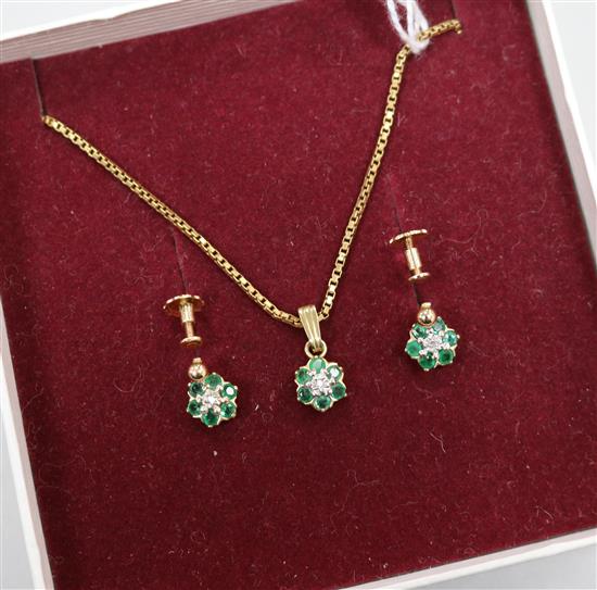 An emerald and diamond cluster pendant and a pair of earrings en suite, 9ct gold settings and suspension.